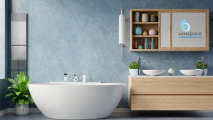 Modern bathroom with freestanding bathtub and wooden vanity by Unispace